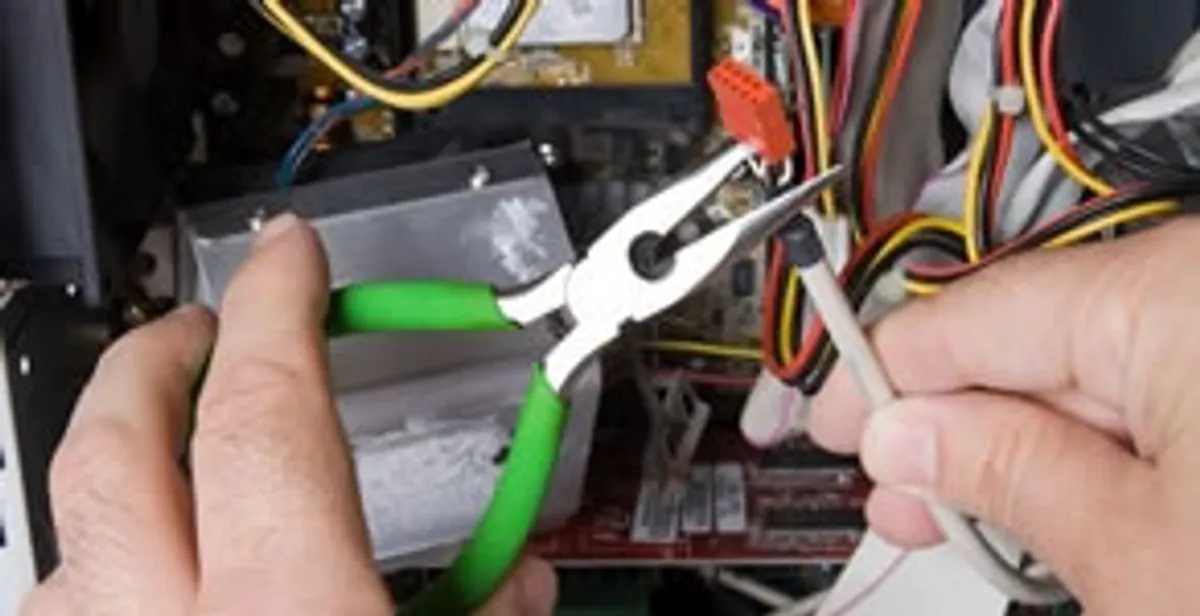 Licensed electrical contractor performing electrical repair with tools in Wadmalaw Island, SC