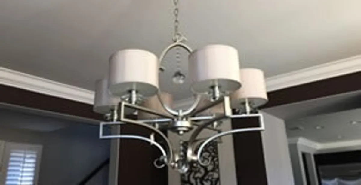 Modern chandelier installation with multiple light fixtures in Charleston, SC